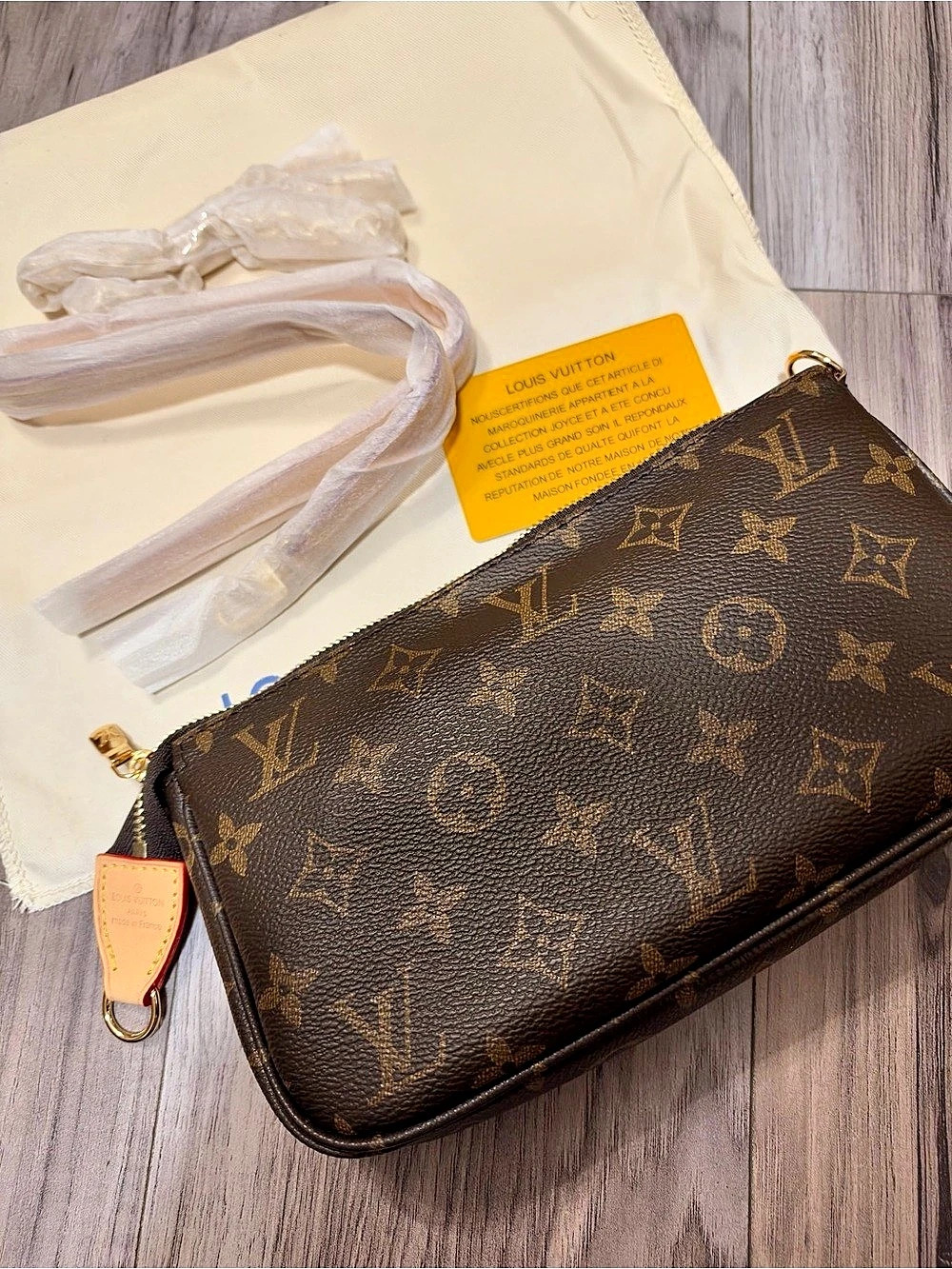 Louis Vuitton Pochette Accessoires Monogram in Brown